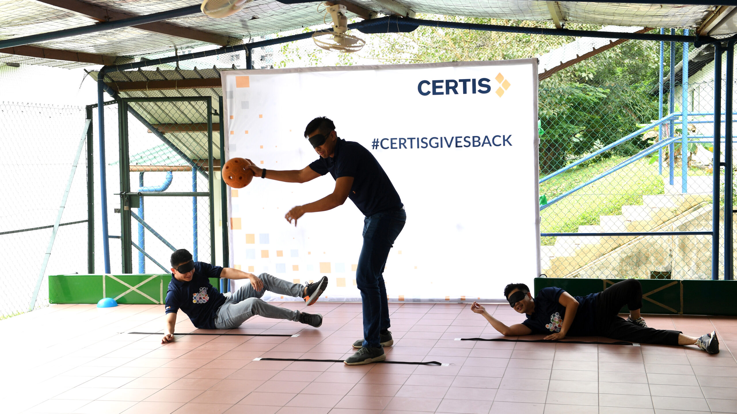 Certis_employees_trying_their_hands_at_Goalball_at_the_Launch_of_Dare_to_Dream__which_was_organised_at_Lighthouse_School__1__Final