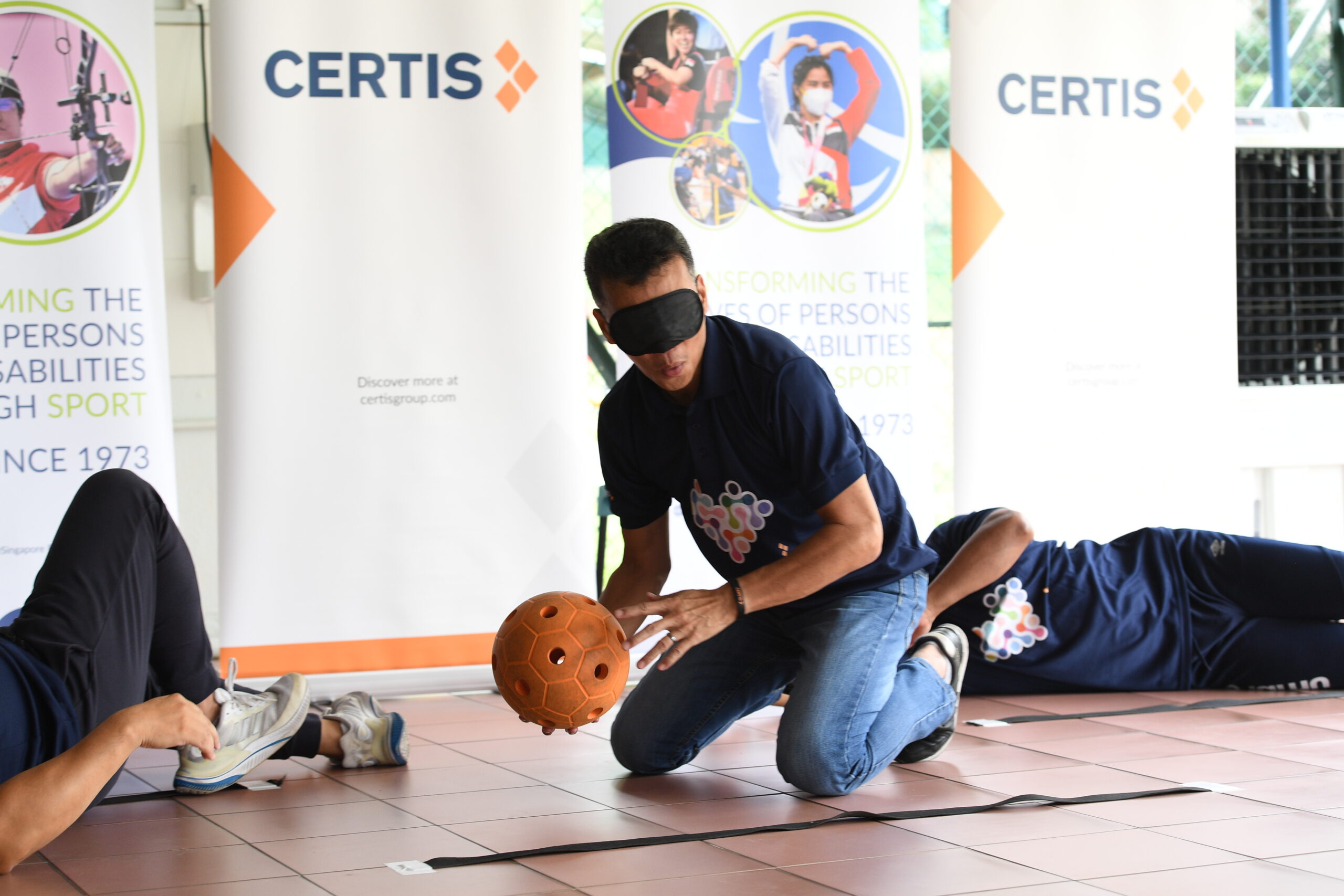 Certis_employees_trying_their_hands_at_Goalball_at_the_Launch_of_Dare_to_Dream__which_was_organised_at_Lighthouse_School__2_