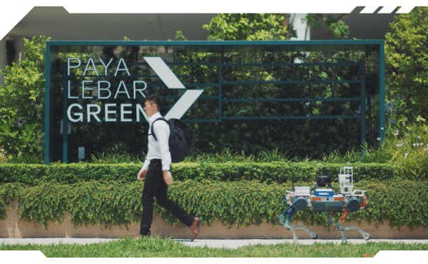 Autonomous quadruped security robot conducting outdoor security patrol at Paya Lebar Green, demonstrating robotics for security operations, autonomous surveillance, and multi terrain mobility in a smart facilities environment.